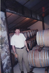 Michael Ponzi Among Wine Barrels