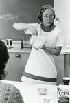 Mary Paul Demonstrates Cooking by Reid Blackburn