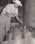 Paul Bjelland Removes Wine from Barrels for Tasting by Unknown